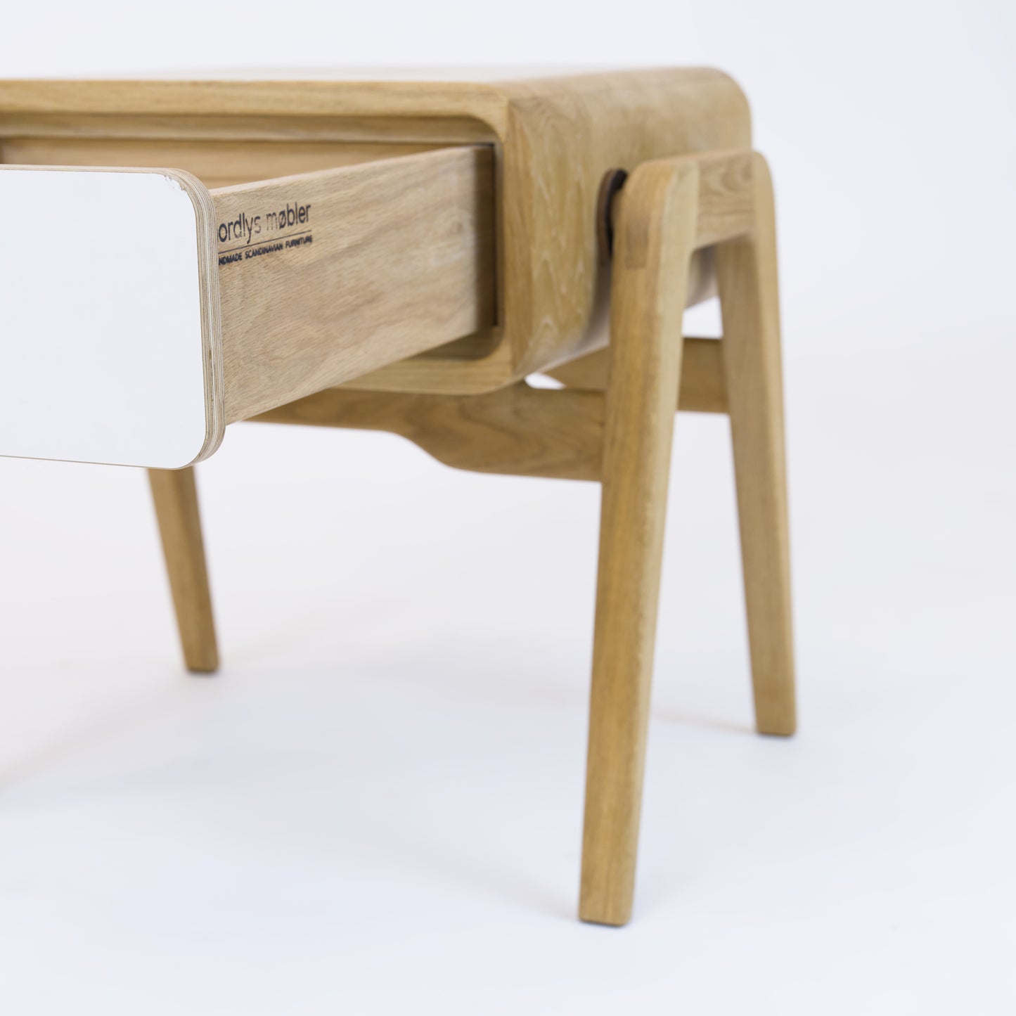 Low desk and storage bench nm11L. The main corpus is crafted from solid Norwegian oak, featuring 1 drawer with white front.