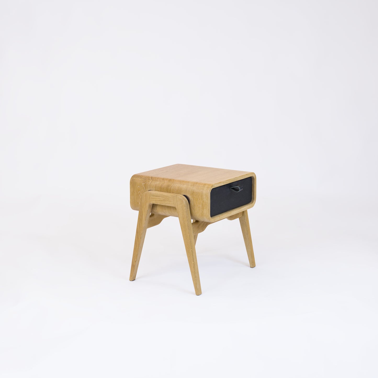 Low nightstand nm11L. The main corpus is crafted from solid Norwegian oak, featuring 1 drawer with black oak front.