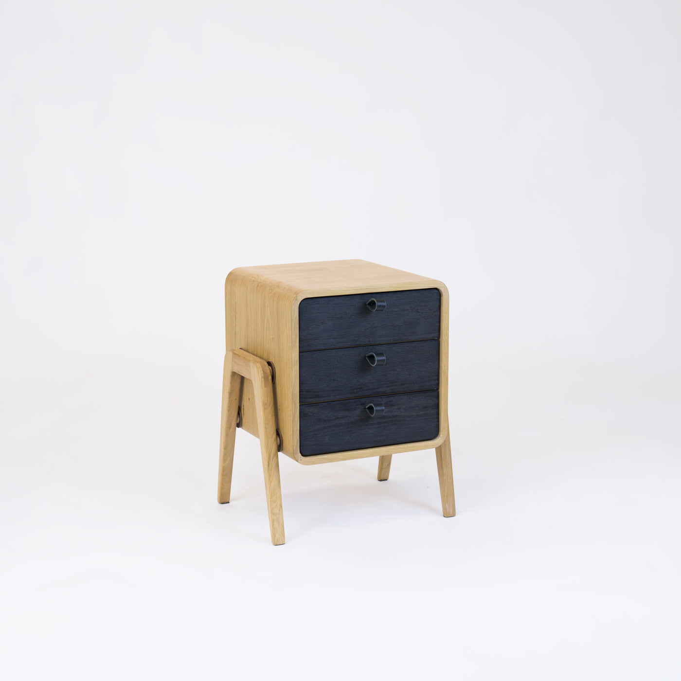 Low nightstand nm31L. The main corpus is crafted from solid Norwegian oak, featuring 3 drawers with black oak front.