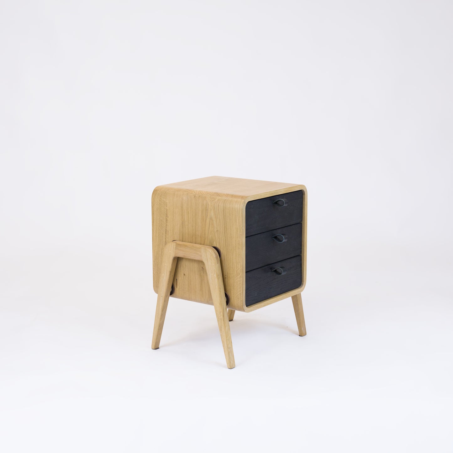 Low nightstand nm31L. The main corpus is crafted from solid Norwegian oak, featuring 3 drawers with black oak front.