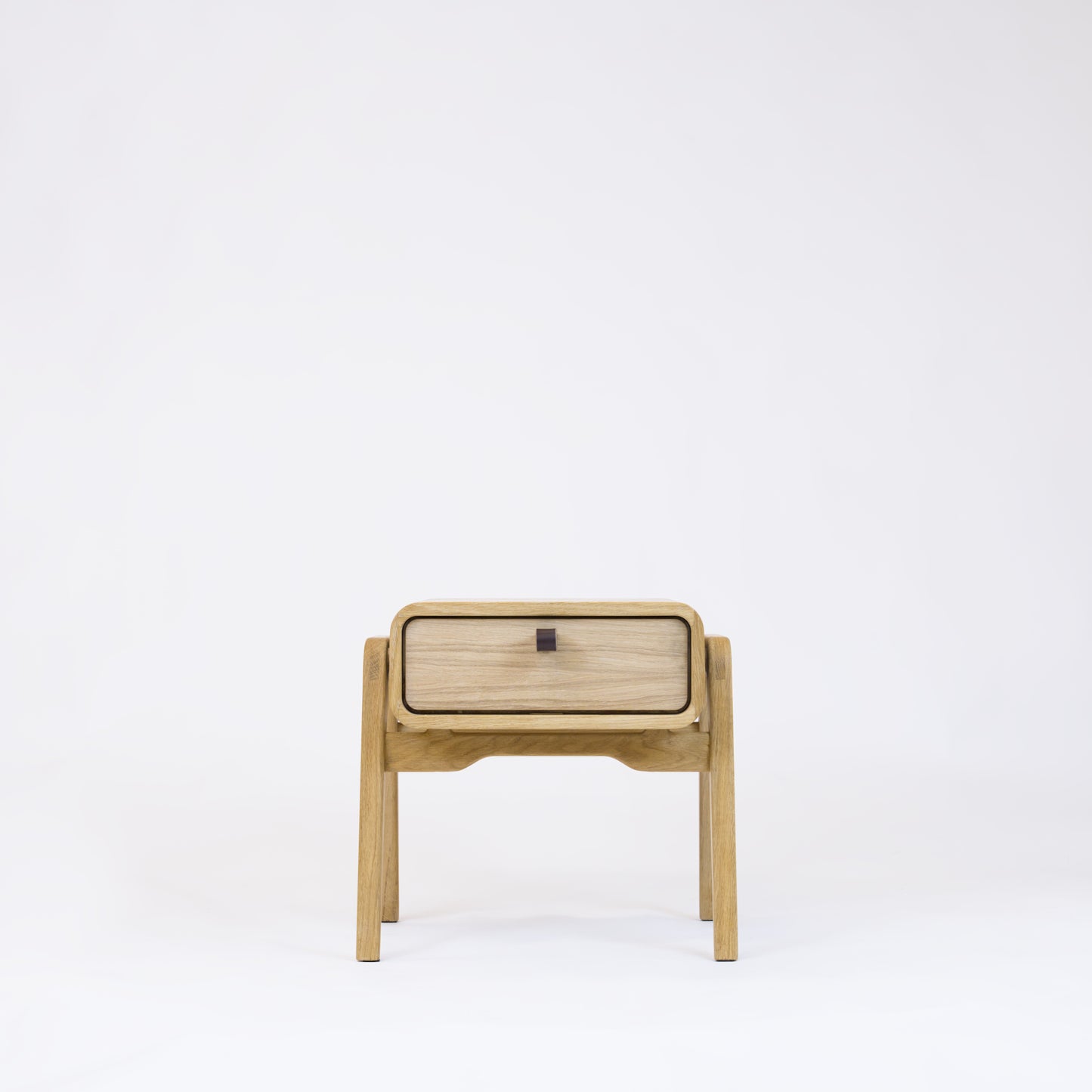 Low nightstand nm11L. The main corpus is crafted from solid Norwegian oak, featuring 1 drawer with natural oak front.
