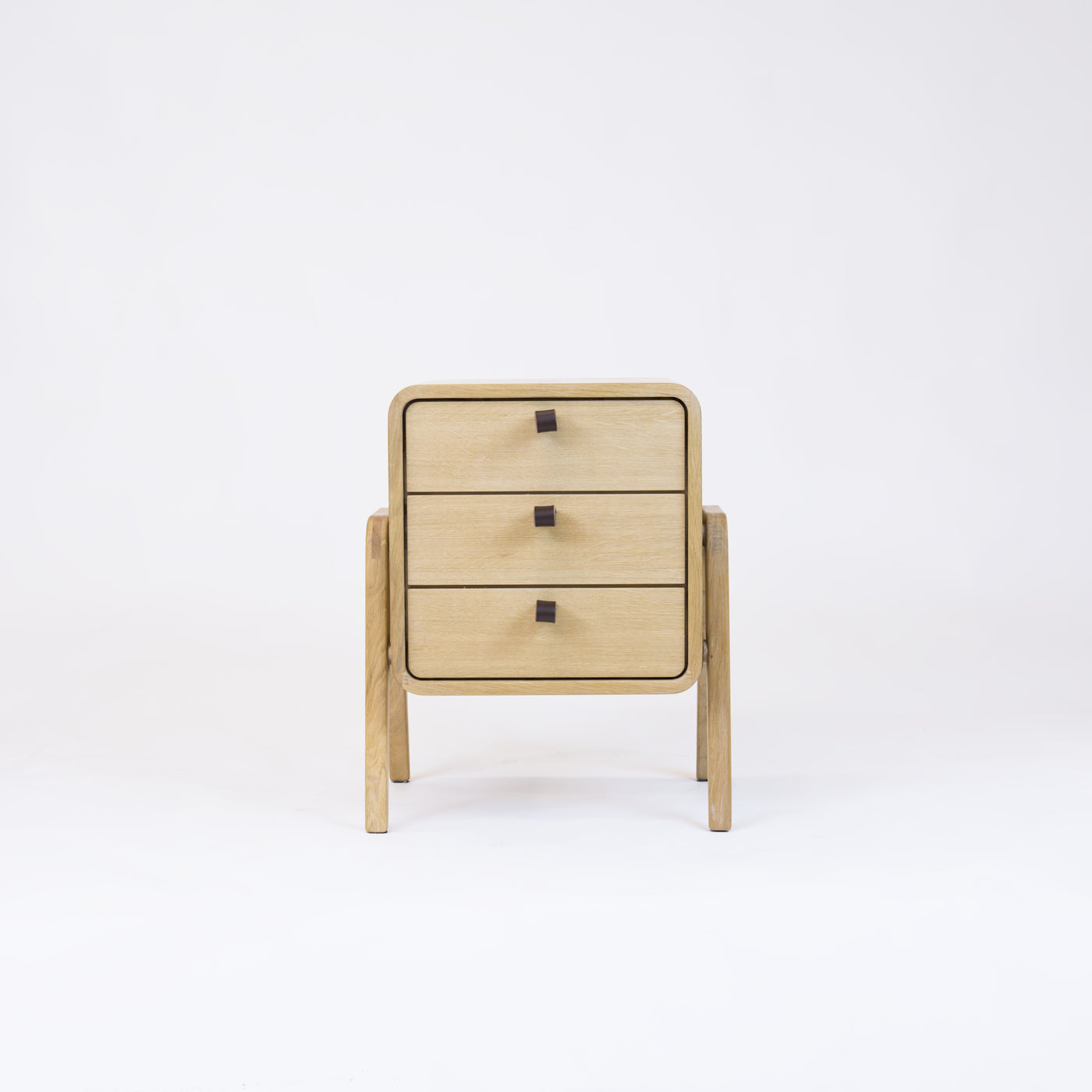 Low nightstand nm31L. The main corpus is crafted from solid Norwegian oak, featuring 3 drawers with natural oak front.