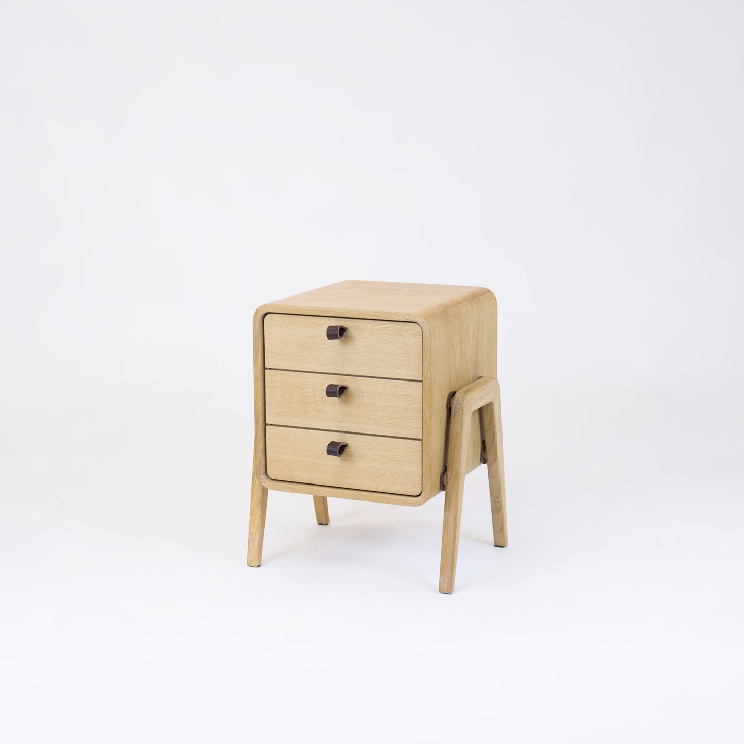 Low nightstand nm31L. The main corpus is crafted from solid Norwegian oak, featuring 3 drawers with natural oak front.