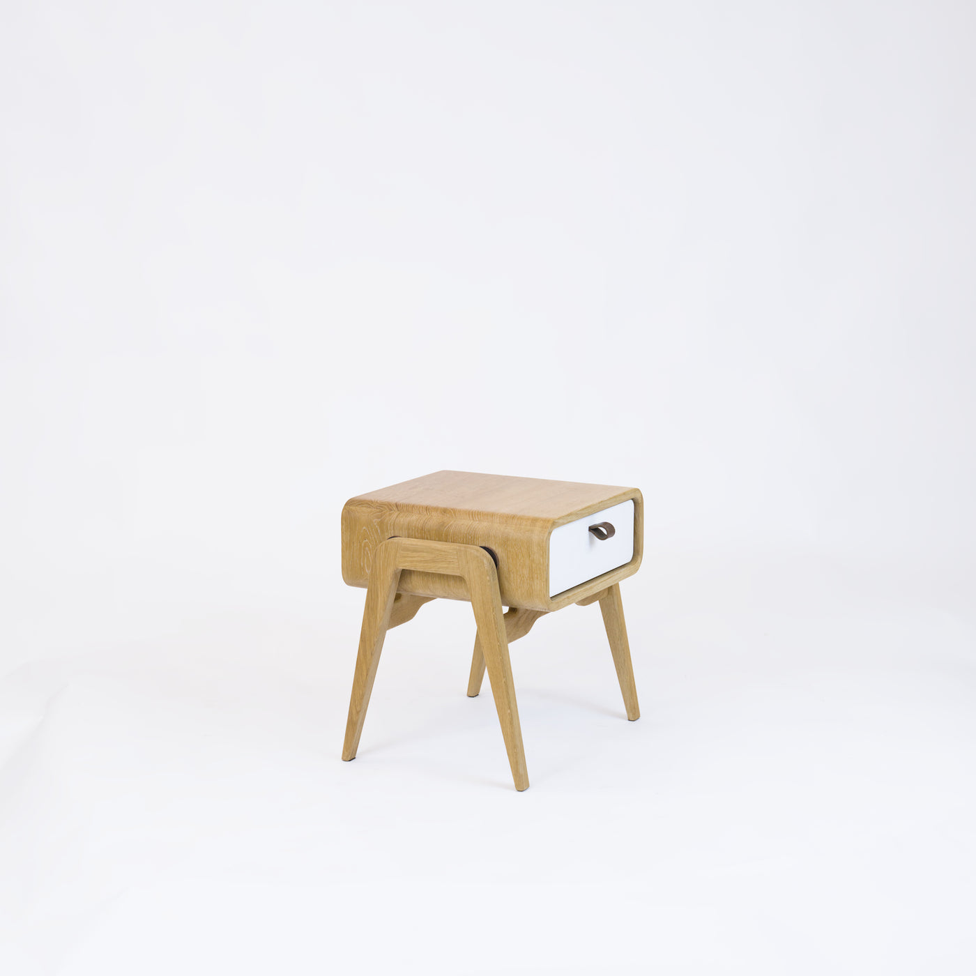 Low nightstand nm11L. The main corpus is crafted from solid Norwegian oak, featuring 1 drawer with white front.
