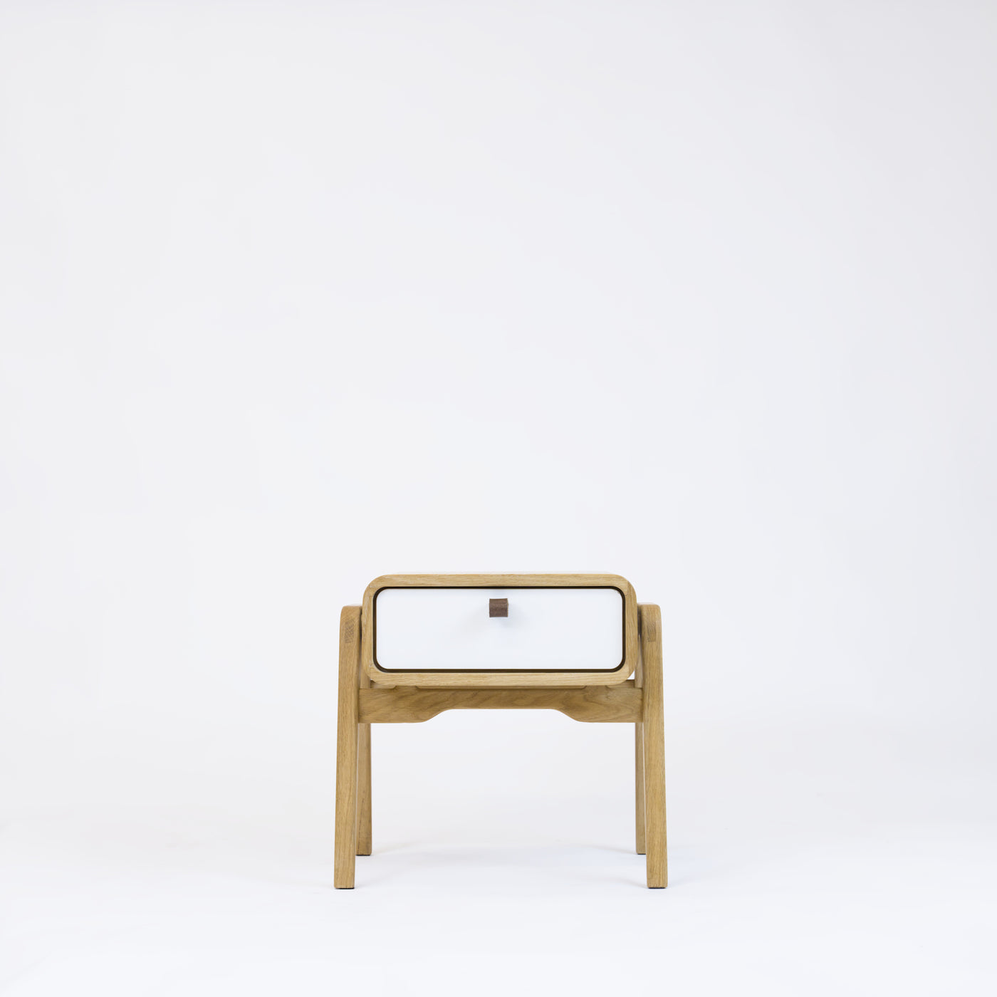Low nightstand nm11L. The main corpus is crafted from solid Norwegian oak, featuring 1 drawer with white front.