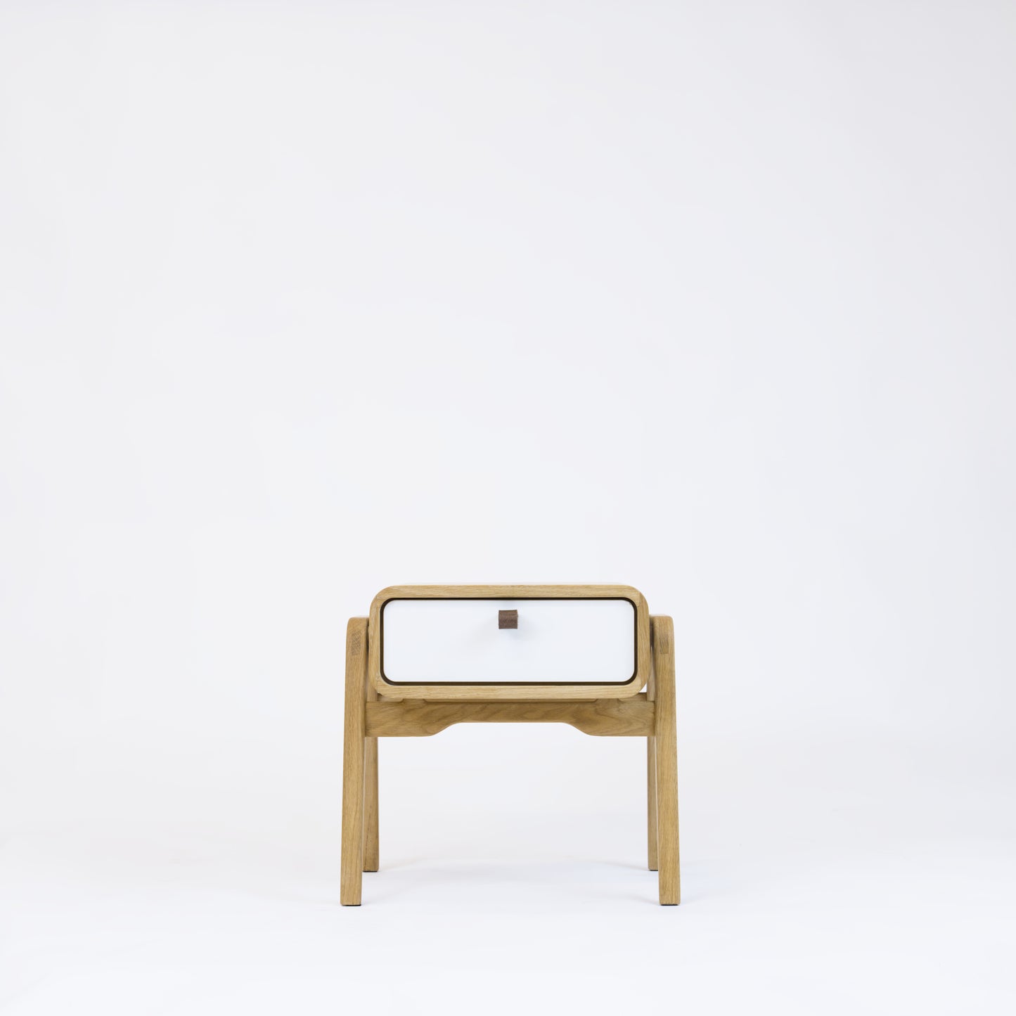 Low nightstand nm11L. The main corpus is crafted from solid Norwegian oak, featuring 1 drawer with white front.