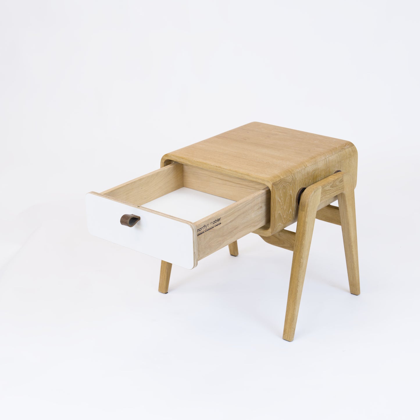 Low nightstand nm11L. The main corpus is crafted from solid Norwegian oak, featuring 1 drawer with white front.