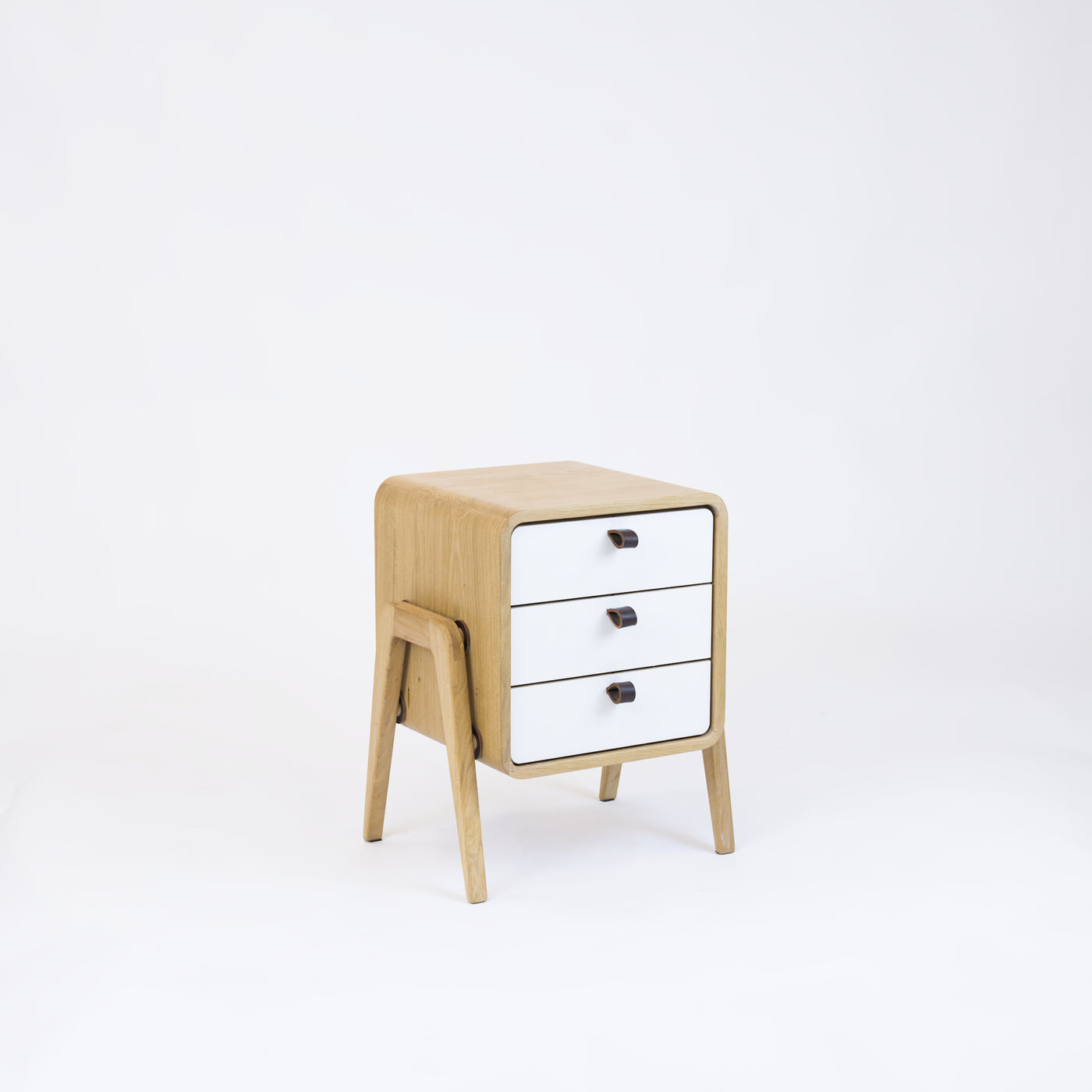Low nightstand nm31L. The main corpus is crafted from solid Norwegian oak, featuring 3 drawers with white front.