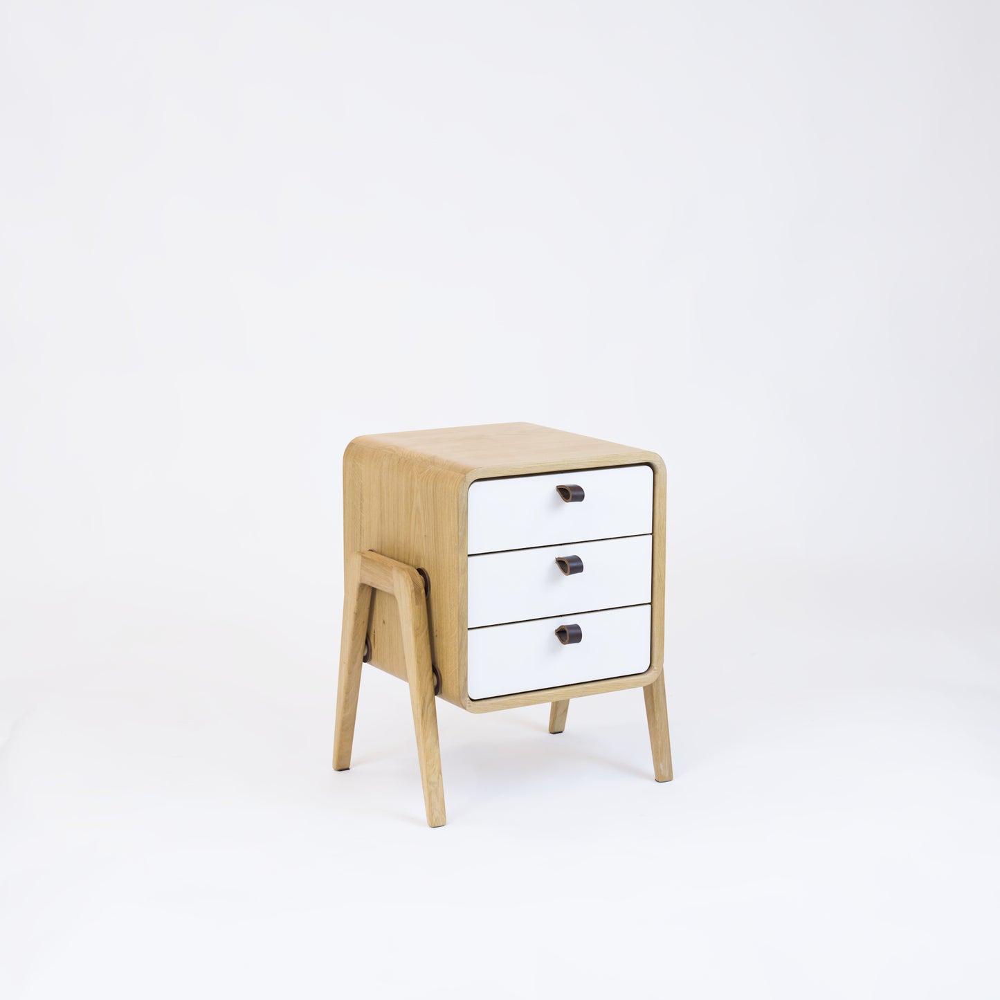 Low nightstand nm31L. The main corpus is crafted from solid Norwegian oak, featuring 3 drawers with white front.