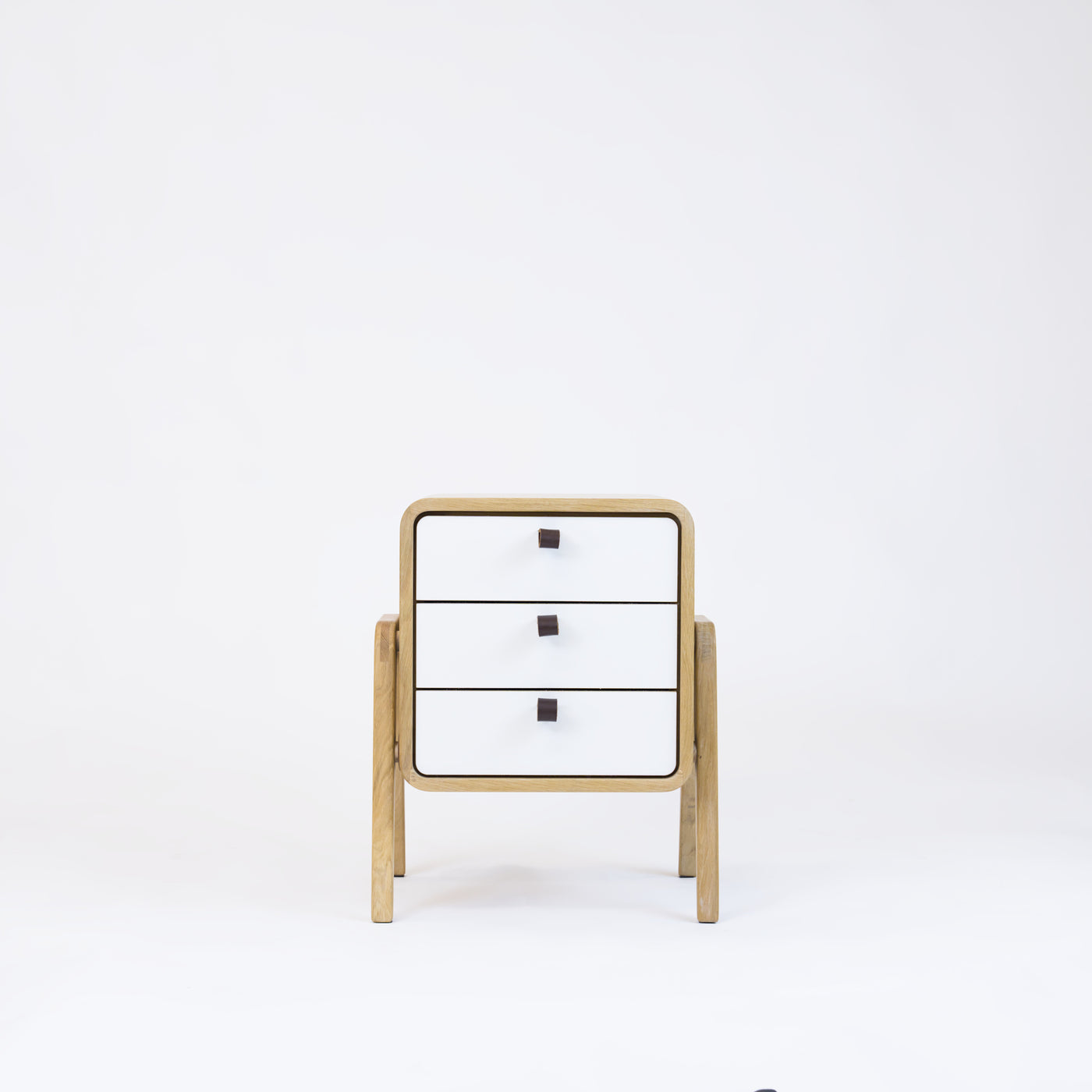 Low nightstand nm31L. The main corpus is crafted from solid Norwegian oak, featuring 3 drawers with white front.