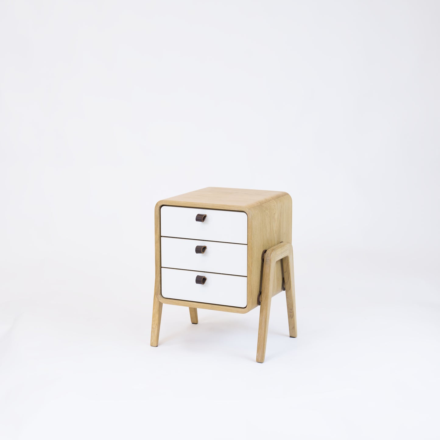 Low nightstand nm31L. The main corpus is crafted from solid Norwegian oak, featuring 3 drawers with white front.